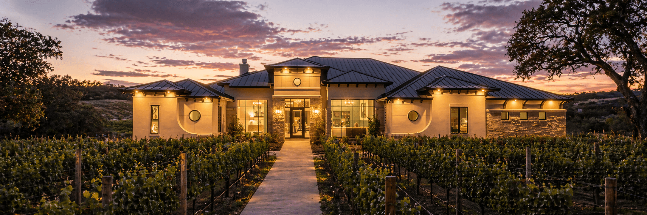 The Mourvèdre - illuminated Hill Country residence at twilight